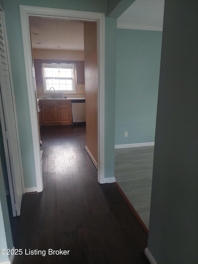 2508 Rhett Ct, Louisville, KY 40242 - hall featuring a sink, dark wood-type flooring, and baseboards