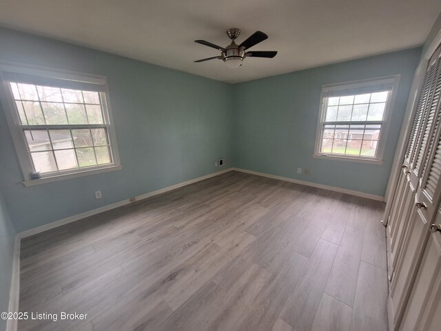 2508 Rhett Ct, Louisville, KY 40242 - spare room featuring light wood finished floors, a ceiling fan, and baseboards