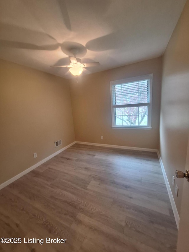 2508 Rhett Ct, Louisville, KY 40242 - empty room with wood finished floors, a ceiling fan, and baseboards