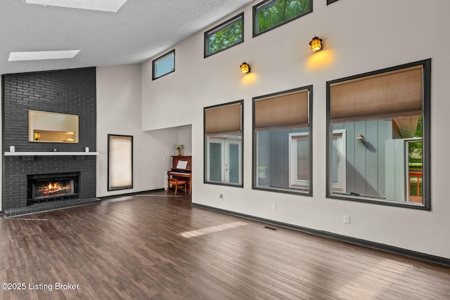 4308 Fence Pl, Louisville, KY 40241 - unfurnished living room featuring wood finished floors, a fireplace, high vaulted ceiling, and baseboards