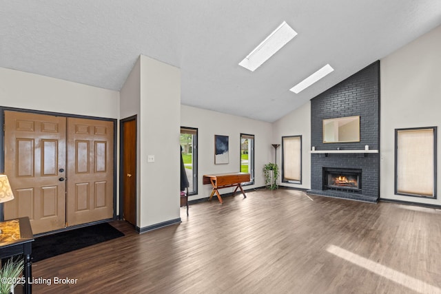 4308 Fence Pl, Louisville, KY 40241 - unfurnished living room with wood finished floors, a fireplace, a skylight, and high vaulted ceiling