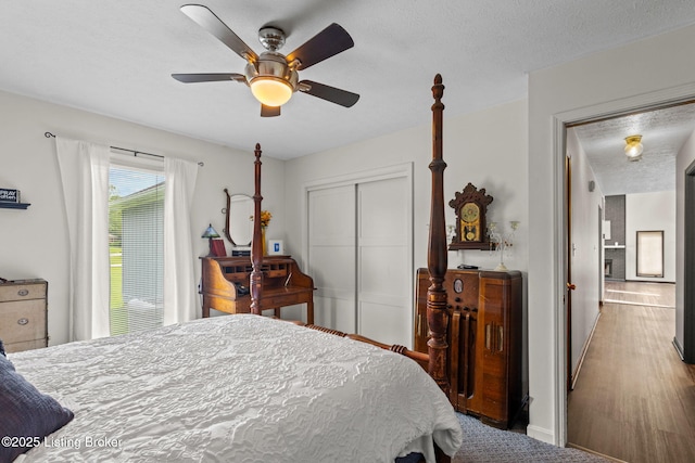 4308 Fence Pl, Louisville, KY 40241 - bedroom featuring a closet, ceiling fan, a textured ceiling, and wood finished floors