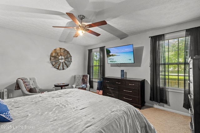 4308 Fence Pl, Louisville, KY 40241 - bedroom with light carpet, multiple windows, baseboards, a textured ceiling, and a ceiling fan