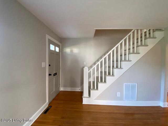 820 Johnson St, Bardstown, KY 40004 - foyer entrance with baseboards, wood finished floors, and stairway