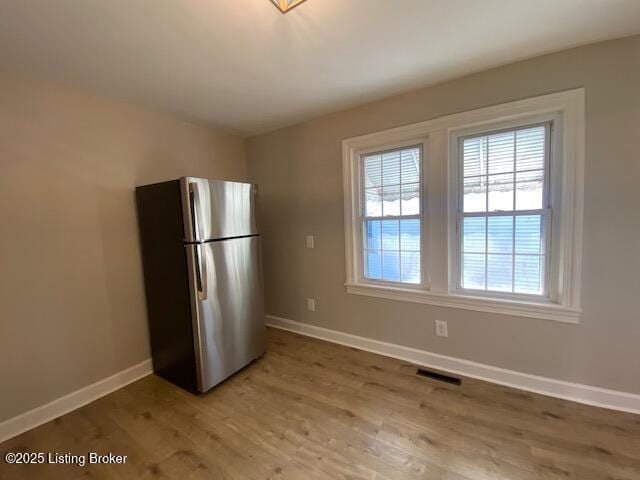 820 Johnson St, Bardstown, KY 40004 - kitchen with freestanding refrigerator, plenty of natural light, and baseboards
