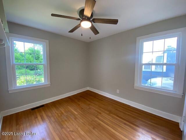 820 Johnson St, Bardstown, KY 40004 - spare room featuring baseboards, wood finished floors, and ceiling fan