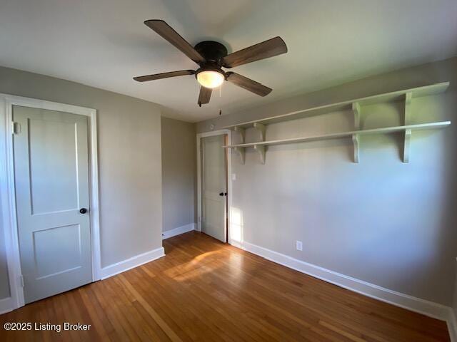 820 Johnson St, Bardstown, KY 40004 - unfurnished bedroom with baseboards, wood finished floors, a closet, and a ceiling fan