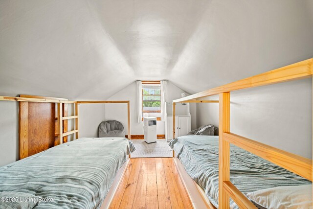 1883 Allgeier Ct, Louisville, KY 40213 - bedroom featuring lofted ceiling, hardwood / wood-style flooring, and baseboards