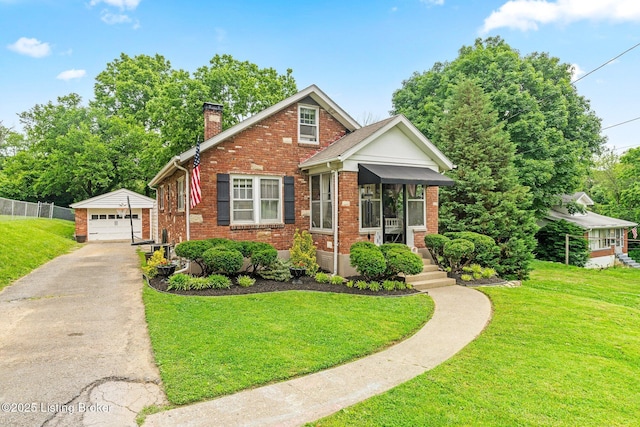 1883 Allgeier Ct, Louisville, KY 40213 - view of front of property featuring an outbuilding, a chimney, brick siding, a detached garage, and asphalt driveway