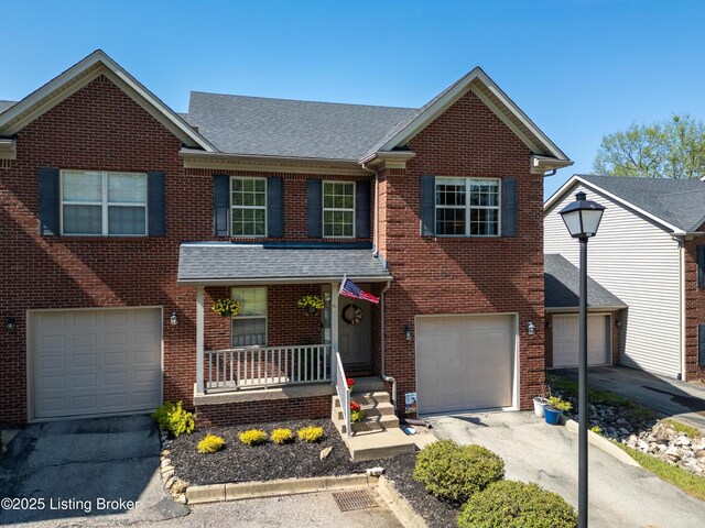 321 Lagrange Villa Dr, La Grange, KY 40031 - view of front of property featuring covered porch, brick siding, a garage, roof with shingles, and driveway