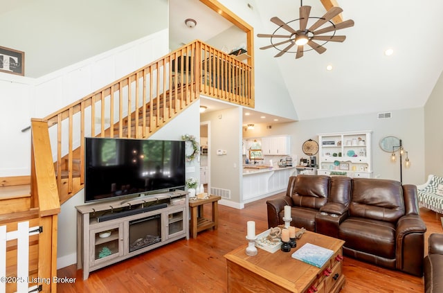 151 Pleasant Railway, Taylorsville, KY 40071 - living area featuring ceiling fan, stairs, high vaulted ceiling, and wood finished floors