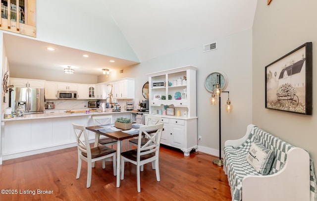 151 Pleasant Railway, Taylorsville, KY 40071 - dining area with vaulted ceiling, recessed lighting, wood finished floors, and baseboards