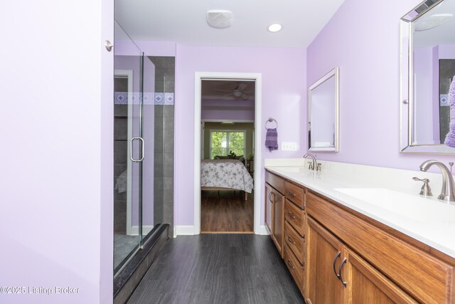 4701 Lost Valley Dr, Crestwood, KY 40014 - ensuite bathroom featuring wood finished floors, double vanity, a stall shower, recessed lighting, and baseboards
