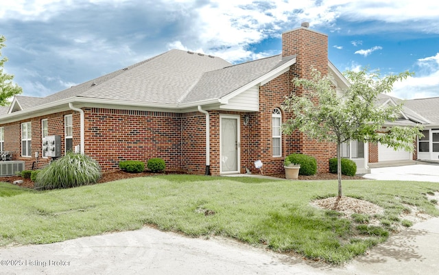 11330 Ridge Lake Dr, Louisville, KY 40272 - view of front facade featuring a chimney, a garage, brick siding, a shingled roof, and cooling unit