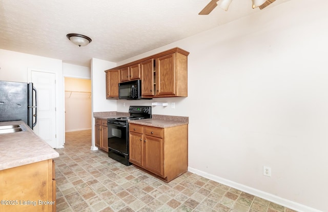 11330 Ridge Lake Dr, Louisville, KY 40272 - kitchen with black appliances, baseboards, and brown cabinets