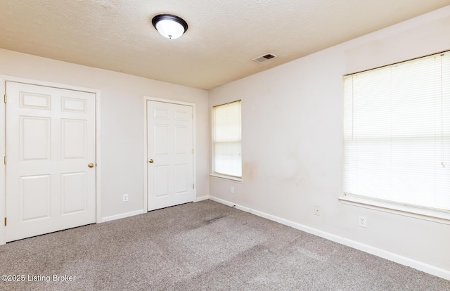 11330 Ridge Lake Dr, Louisville, KY 40272 - unfurnished bedroom with carpet floors, baseboards, and a textured ceiling
