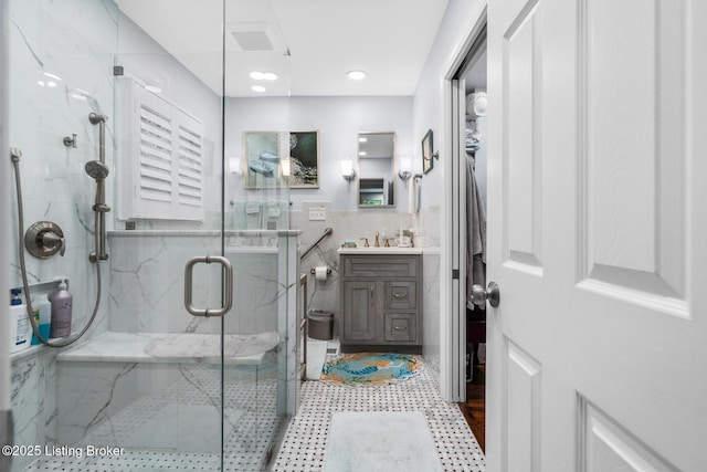 12104 Locust Ln, Anchorage, KY 40223 - full bathroom with a marble finish shower, tile walls, vanity, and wainscoting