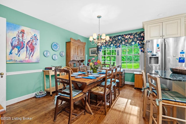 12104 Locust Ln, Anchorage, KY 40223 - dining room with a chandelier, light wood-style flooring, and baseboards