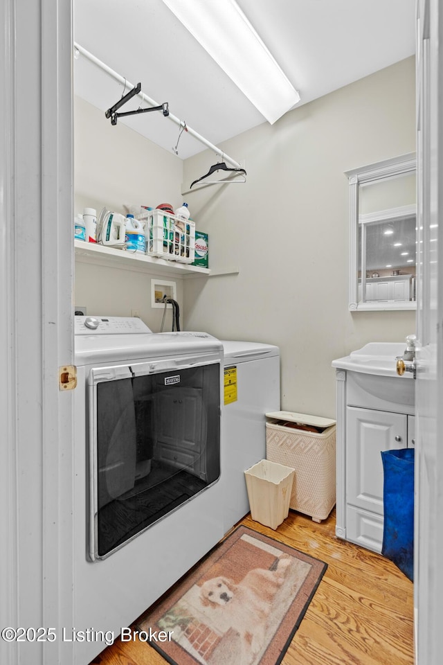 12104 Locust Ln, Anchorage, KY 40223 - laundry area featuring independent washer and dryer and light wood-type flooring