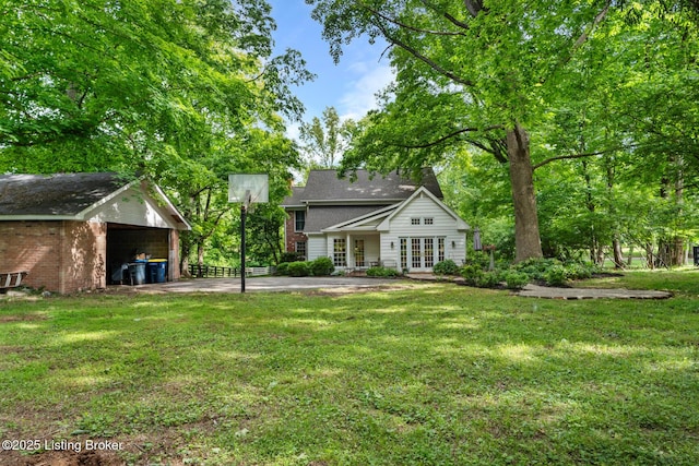 12104 Locust Ln, Anchorage, KY 40223 - rear view of house with french doors, a yard, and an outbuilding