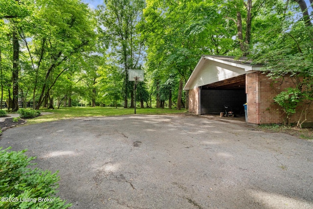 12104 Locust Ln, Anchorage, KY 40223 - view of car parking with view of scattered trees and a carport