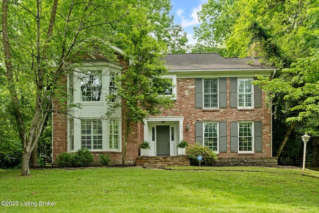 12104 Locust Ln, Anchorage, KY 40223 - view of front facade featuring a front yard and brick siding