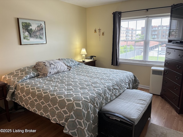 314 El Conquistador Pl, Louisville, KY 40220 - bedroom with wood finished floors, radiator heating unit, and baseboards