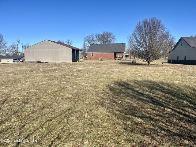 171 Old Kentucky 49, Loretto, KY 40037 - view of green lawn with a pole building and an outdoor structure