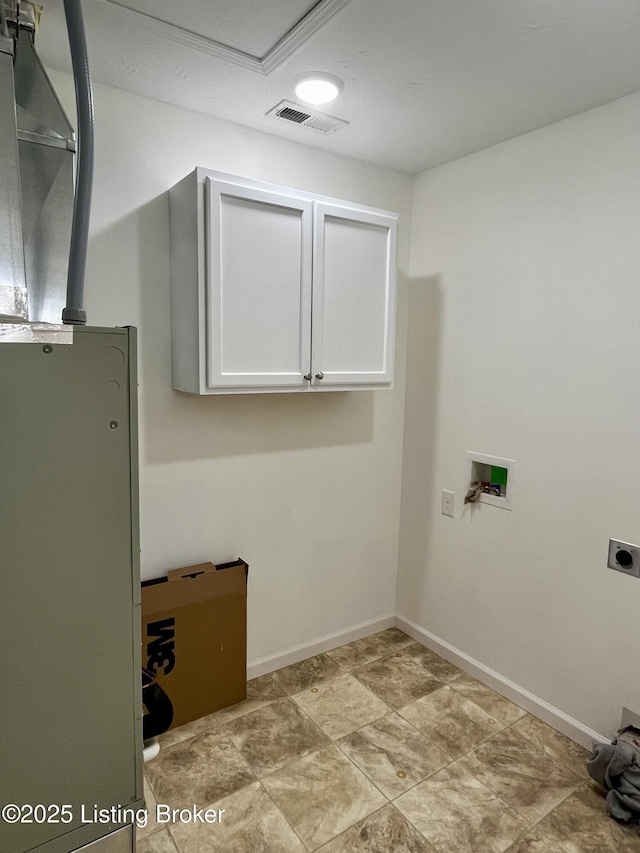 171 Old Kentucky 49, Loretto, KY 40037 - washroom with cabinet space, hookup for an electric dryer, washer hookup, and baseboards