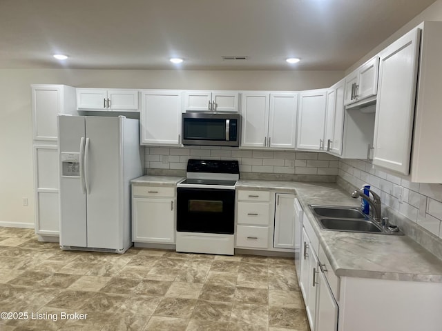 171 Old Kentucky 49, Loretto, KY 40037 - kitchen with white appliances, a sink, light countertops, white cabinetry, and recessed lighting