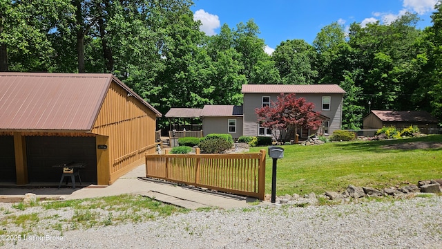 1250 Arnold School Rd, Webster, KY 40176 - view of front of property with metal roof, a garage, an outbuilding, and a front lawn