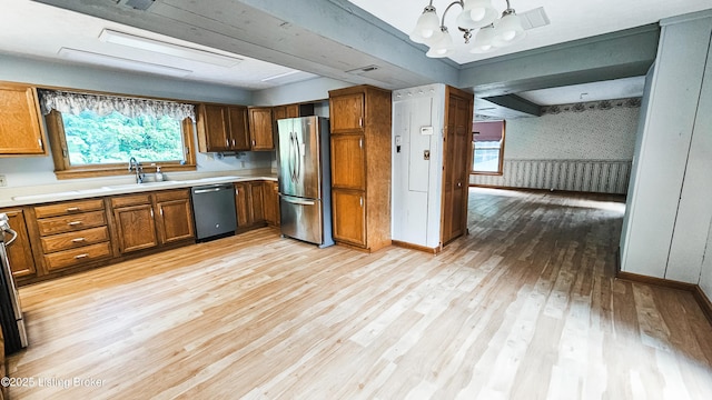 1250 Arnold School Rd, Webster, KY 40176 - kitchen with freestanding refrigerator, dishwasher, a sink, wallpapered walls, and light wood-style flooring