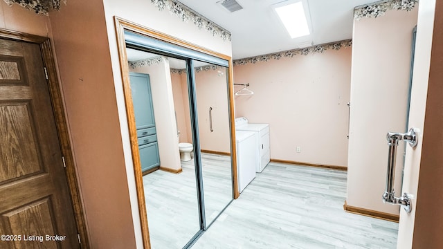 1250 Arnold School Rd, Webster, KY 40176 - laundry room featuring washing machine and dryer, light wood finished floors, and baseboards