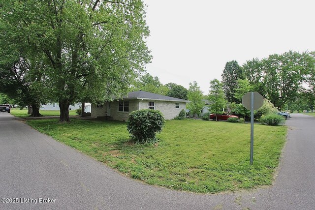 485 Hazzard St, Scottsburg, IN 47170 - view of home's exterior featuring a lawn