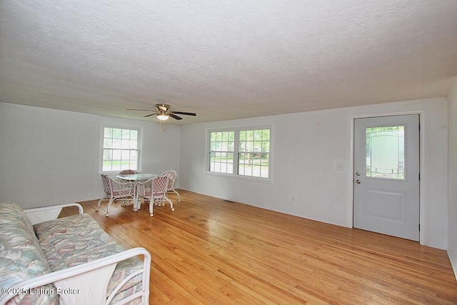 485 Hazzard St, Scottsburg, IN 47170 - living room with light wood-type flooring, ceiling fan, and a textured ceiling