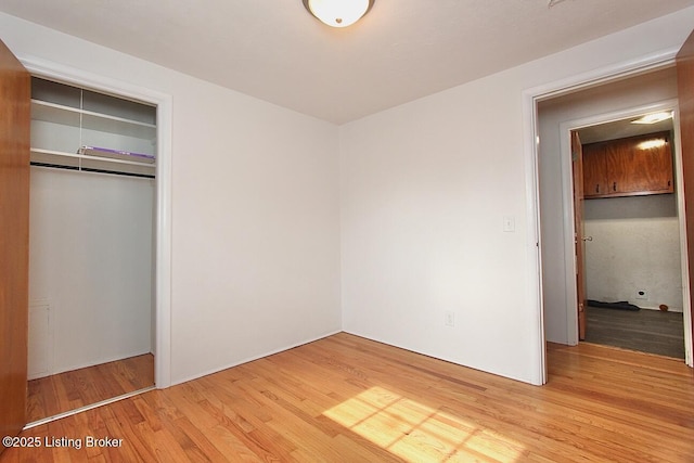 485 Hazzard St, Scottsburg, IN 47170 - unfurnished bedroom with light wood-style flooring and a closet