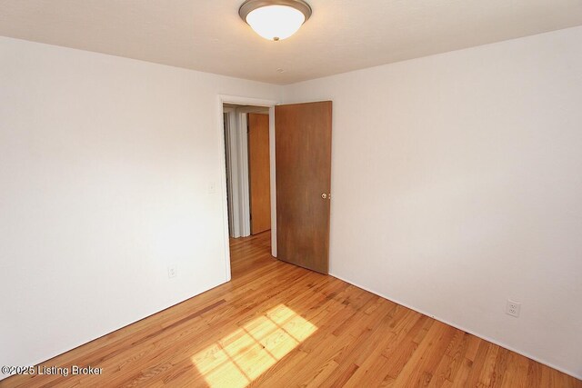 485 Hazzard St, Scottsburg, IN 47170 - unfurnished room with wood finished floors