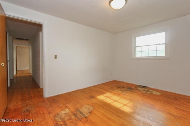 485 Hazzard St, Scottsburg, IN 47170 - spare room featuring hardwood / wood-style flooring