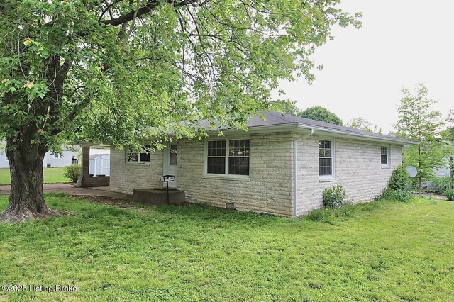 485 Hazzard St, Scottsburg, IN 47170 - view of property exterior with a yard and stone siding