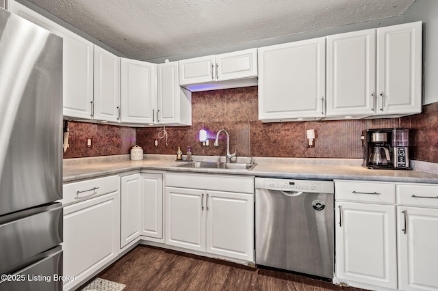 5202 Baywood Dr, Louisville, KY 40241 - kitchen with stainless steel appliances, a sink, light countertops, white cabinetry, and dark wood finished floors