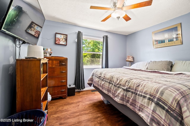 5202 Baywood Dr, Louisville, KY 40241 - bedroom featuring wood finished floors, a textured ceiling, ceiling fan, and baseboards