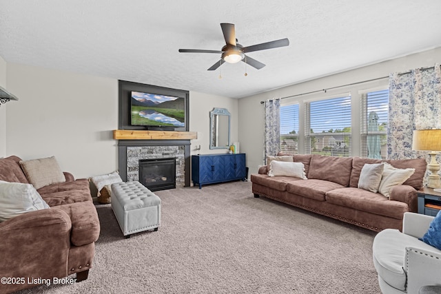 1130 Cherry Hollow Rd, La Grange, KY 40031 - carpeted living area with ceiling fan, a stone fireplace, and a textured ceiling