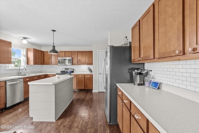 1130 Cherry Hollow Rd, La Grange, KY 40031 - kitchen with appliances with stainless steel finishes, a sink, brown cabinets, tasteful backsplash, and a textured ceiling