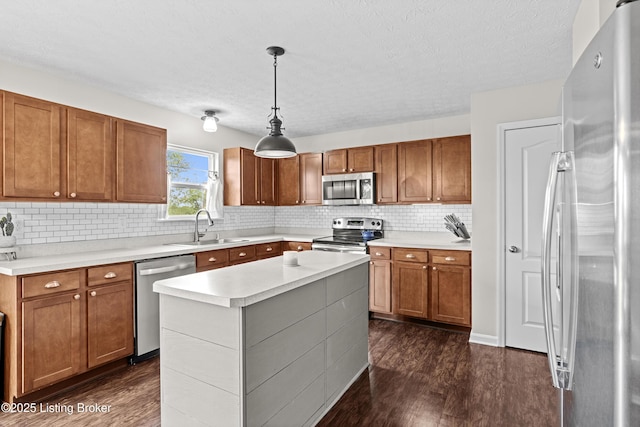 1130 Cherry Hollow Rd, La Grange, KY 40031 - kitchen featuring appliances with stainless steel finishes, a sink, dark wood-style flooring, light countertops, and brown cabinets