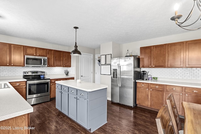 1130 Cherry Hollow Rd, La Grange, KY 40031 - kitchen featuring stainless steel appliances, dark wood-style floors, brown cabinetry, decorative backsplash, and a textured ceiling