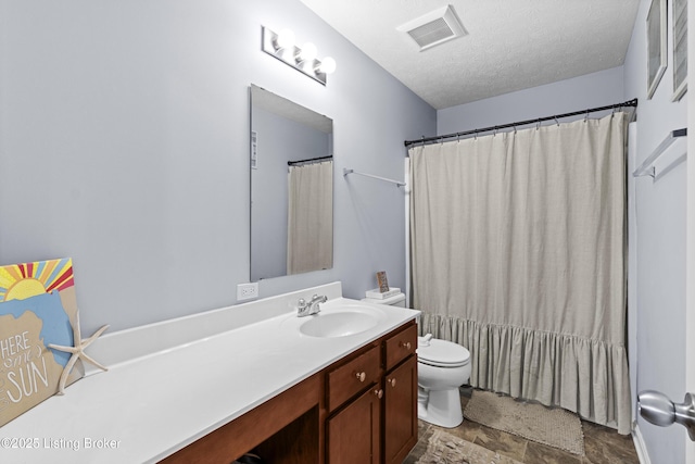 1130 Cherry Hollow Rd, La Grange, KY 40031 - bathroom with toilet, vanity, stone finish floors, and a textured ceiling