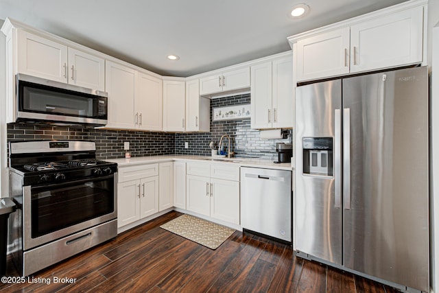 3400 Dell Rd, Louisville, KY 40299 - kitchen featuring appliances with stainless steel finishes, a sink, light countertops, white cabinetry, and recessed lighting