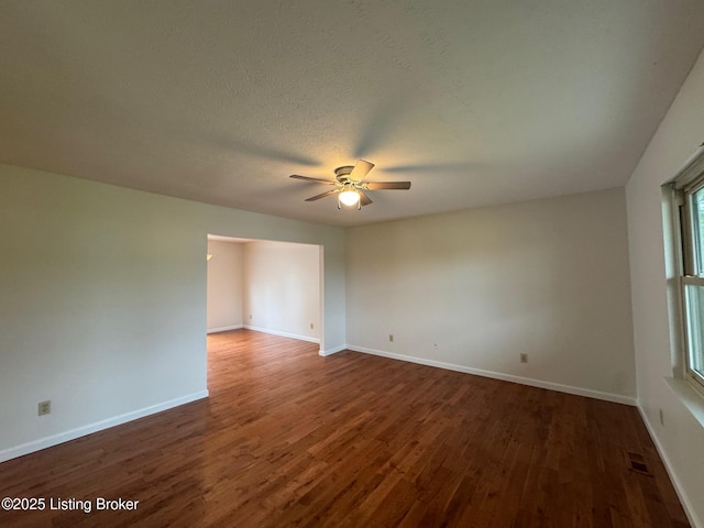 45 Paula Ct, Ekron, KY 40117 - empty room with ceiling fan, dark wood-style flooring, and baseboards