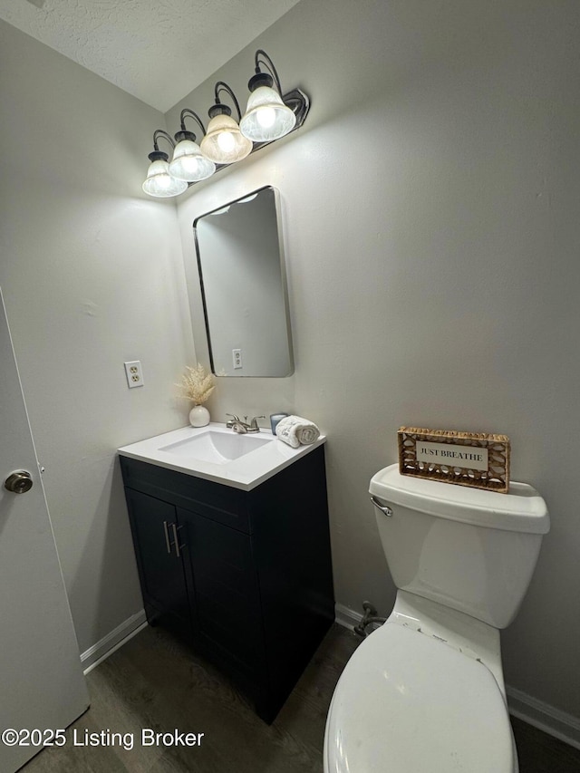 45 Paula Ct, Ekron, KY 40117 - bathroom featuring vanity, toilet, and baseboards