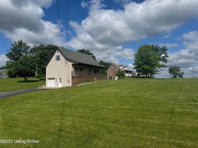 45 Paula Ct, Ekron, KY 40117 - view of green lawn featuring driveway and an attached garage